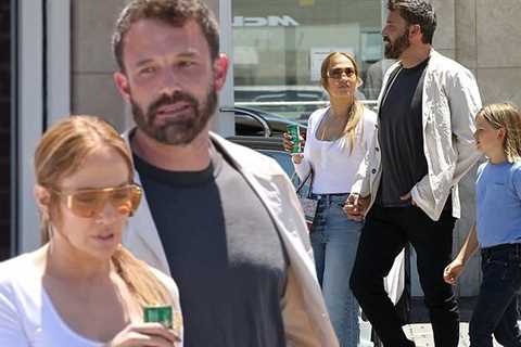 Ben Affleck and Jennifer Lopez look casual as they browse luxury cars