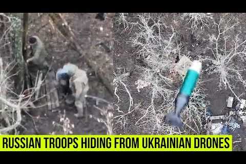 Russian troops hiding from the Ukrainian quadcopter drone strikes.